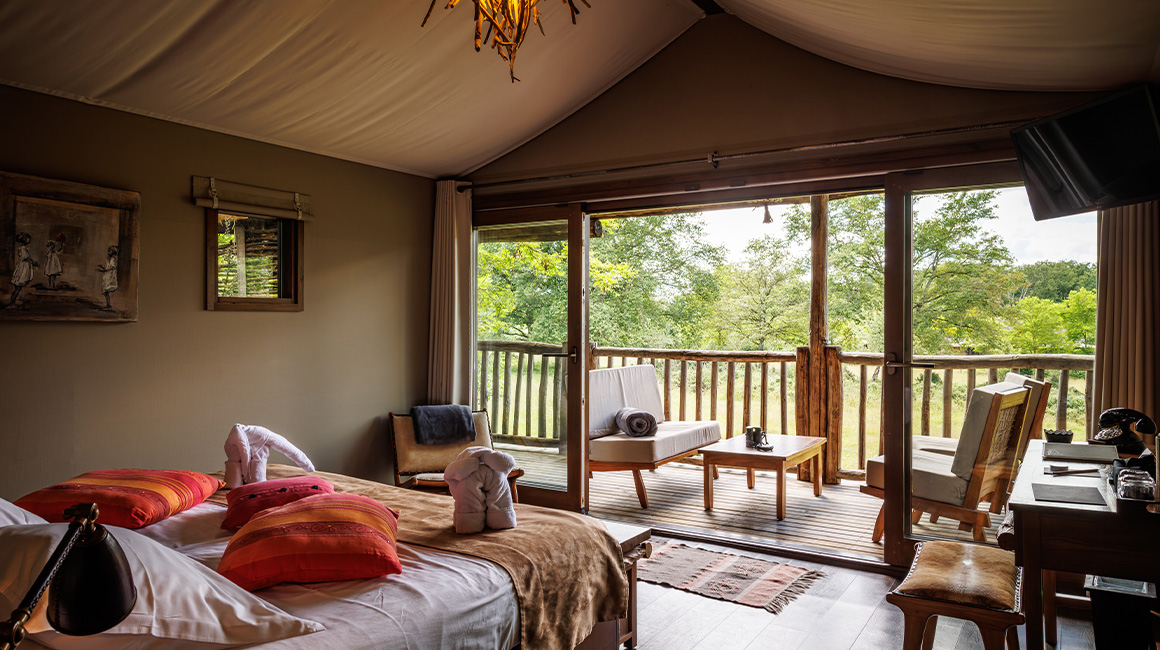 Enjoy a magnificent master bedroom with a breathtaking view of the savannah
